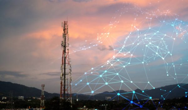 Telecommunication Tower for 2G 3G 4G 5G network during sunset. Antenna, BTS, microwave, repeater, base station, IOT. Technology concept in internet and mobile communication.